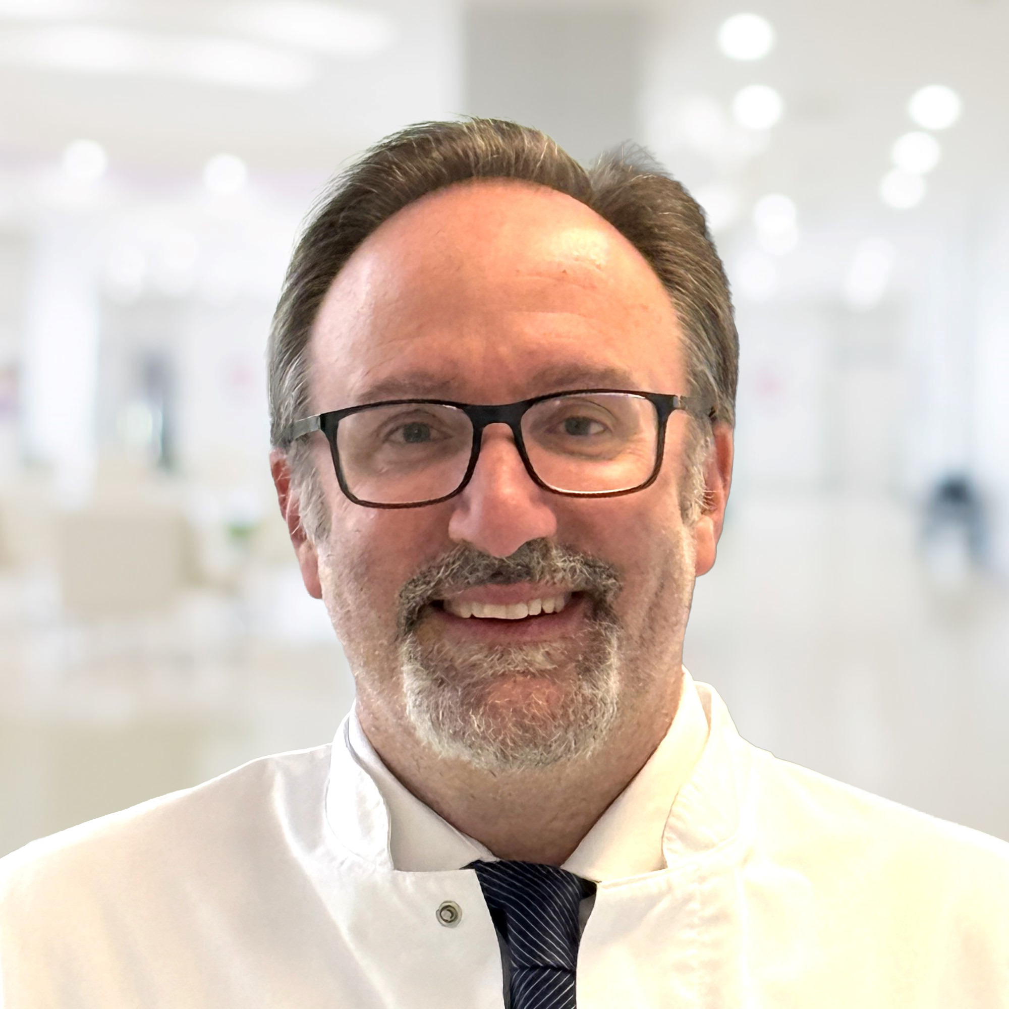 Dr. univ. med. Andre Tomasino